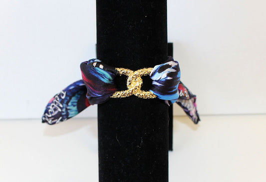 Pulsera Infinity de seda con máscara de pavo real